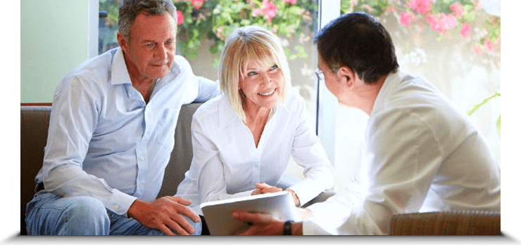 Stock Image of Old Couples Discussion with Doctor